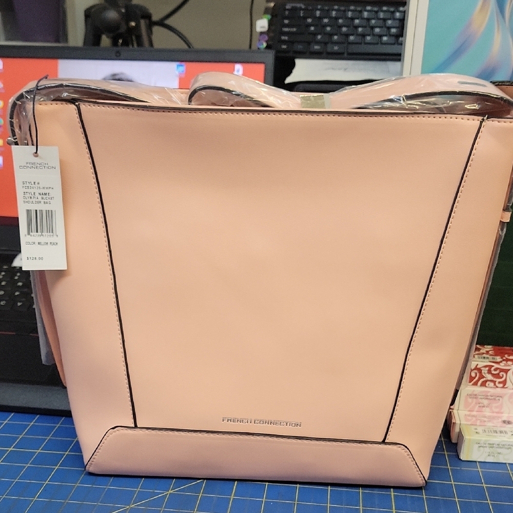 French Connection Olympia Bucket Shoulder Bag in the color Mellow Peach 12x13x2